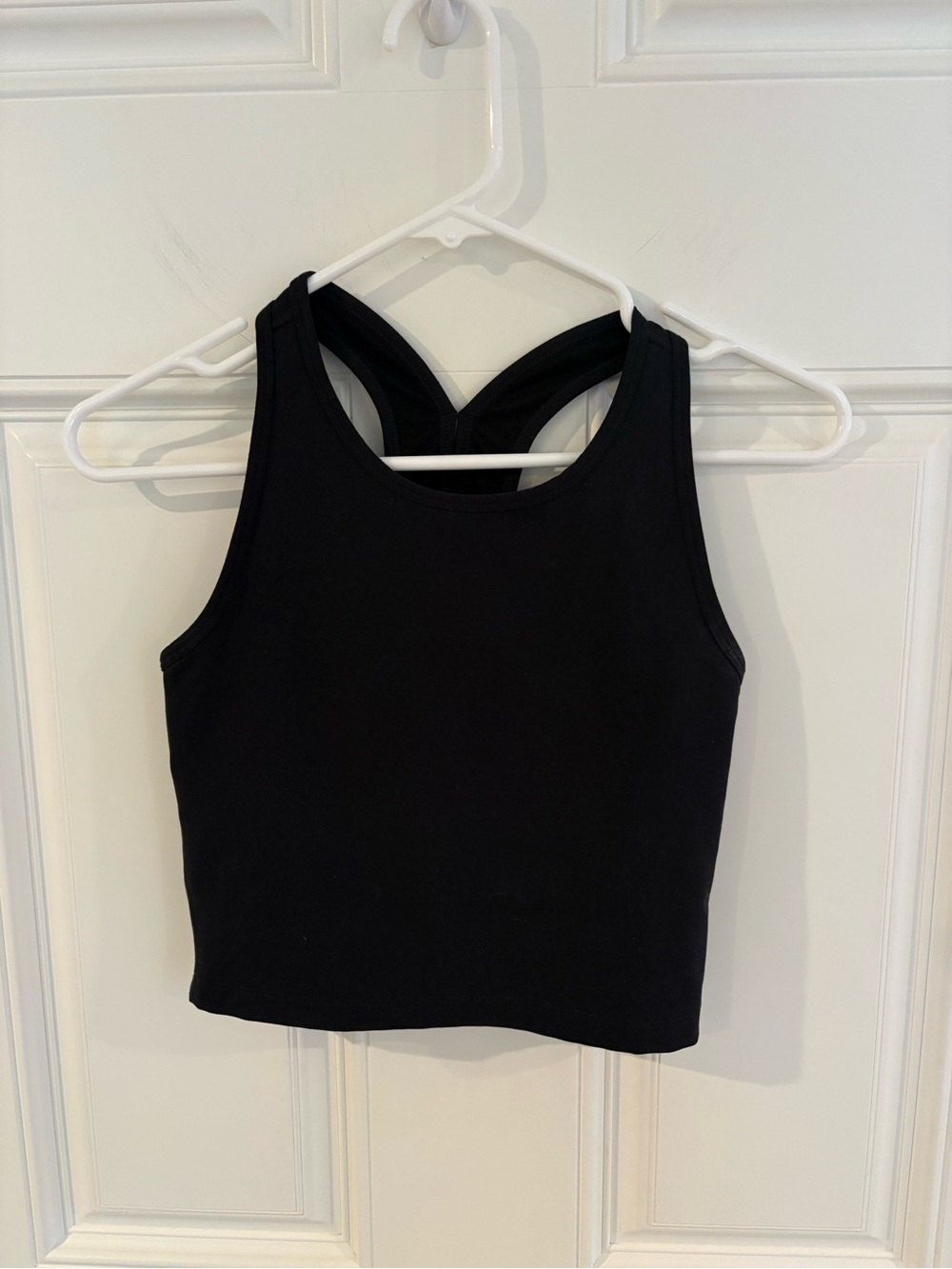 Beyond Yoga PowerBeyond Strive Cropped Bra Top in black. Size small